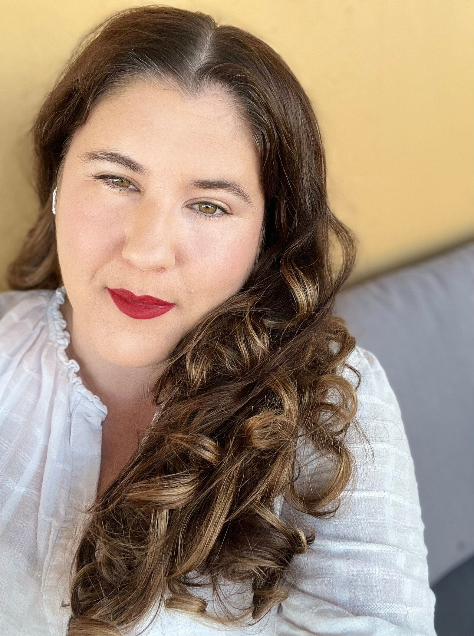 Melinda Issakov, author of interactive children's books Do the Voices series, smiling professional headshot
